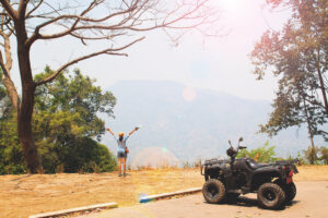 ATV parked at a scenic overlook near Zion National Park with a rider enjoying the mountain view