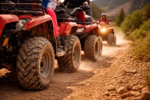 Group of people riding UTVs on a dusty trail in St. George Utah during summer adventure