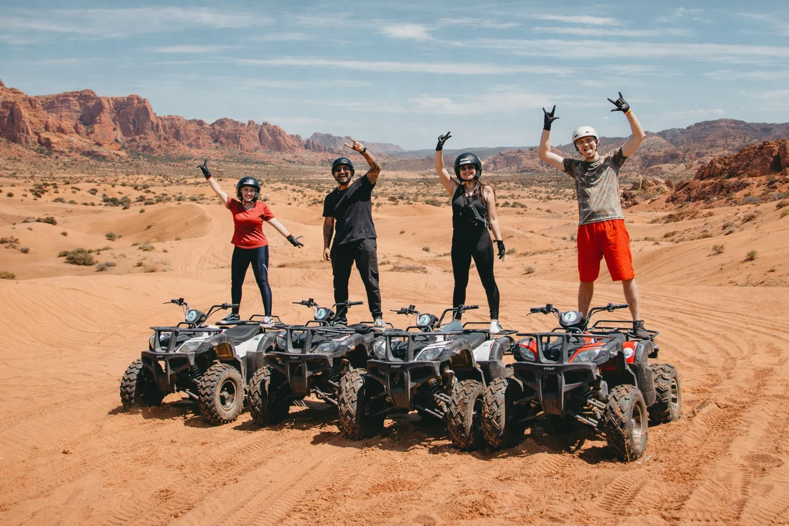 Group ATV rental adventure in Utah sand dunes with friends and family